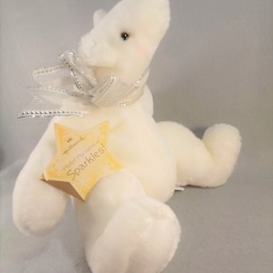Hallmark Sparkles Plush Bear with Silver Star & Bow, White Sparkle Plush Fabric, Sitting Position 11 inches high x 13 inches wide