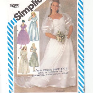 May include: Simplicity sewing pattern number 6241 for a wedding dress. The pattern includes four different styles of dresses, all with long sleeves and a sweetheart neckline. The pattern is for size 8 miss and costs £400. The pattern is sold by Jo-Ann Fabric Shop.