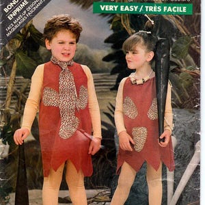 May include: A vintage sewing pattern for two children's costumes. The pattern is for a caveman and cavewoman costume. The pattern is from Butterick and the pattern number is 5806. The pattern is labelled as "Very Easy".