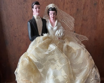 Vintage Chalkware Wedding Cake Topper, Groom in Black Tux, Bride in Lace Dress and Netting Veil on Plastic Pedestal, Marked Rainbow Doll Co