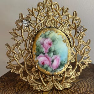 Antique Art Nouveau Gold Gilt Frame Foliate Design with Rhinestones, Clips in Front Display a Hand Painted Victorian Porcelain Rose Keepsake