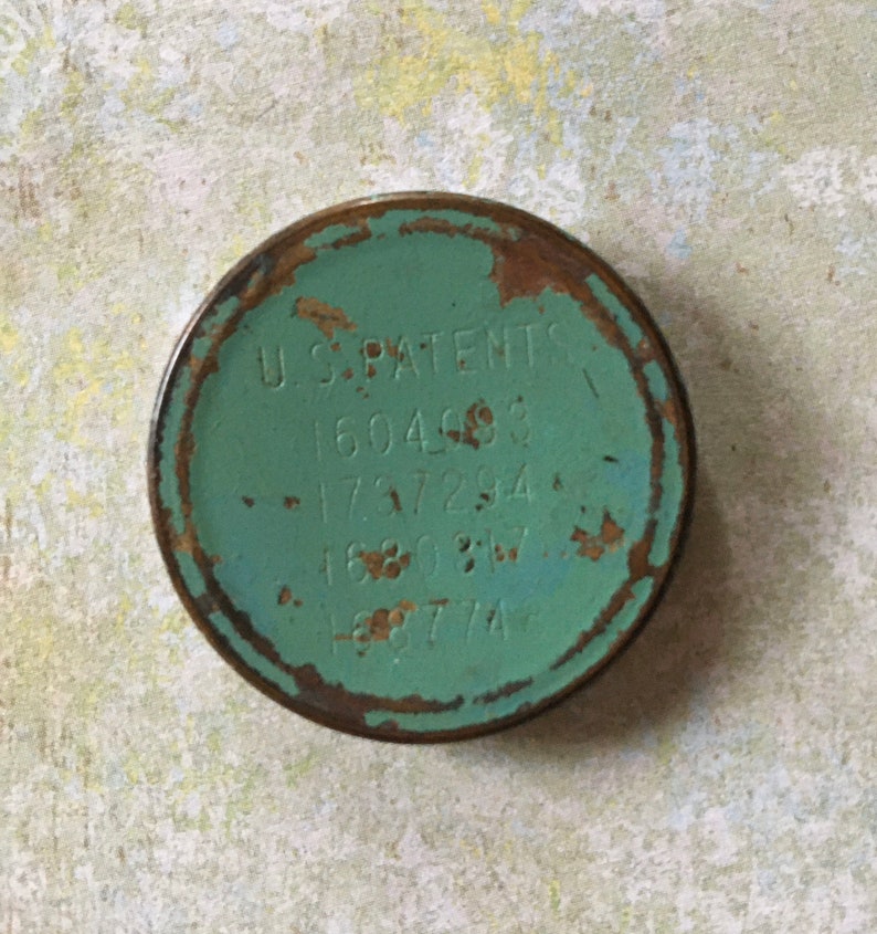 Antique Art Deco Powder Dispensing Spring Loaded Compact with Patents Vanity Collectible Shabby Chic Green with Colonial Couple on Cover