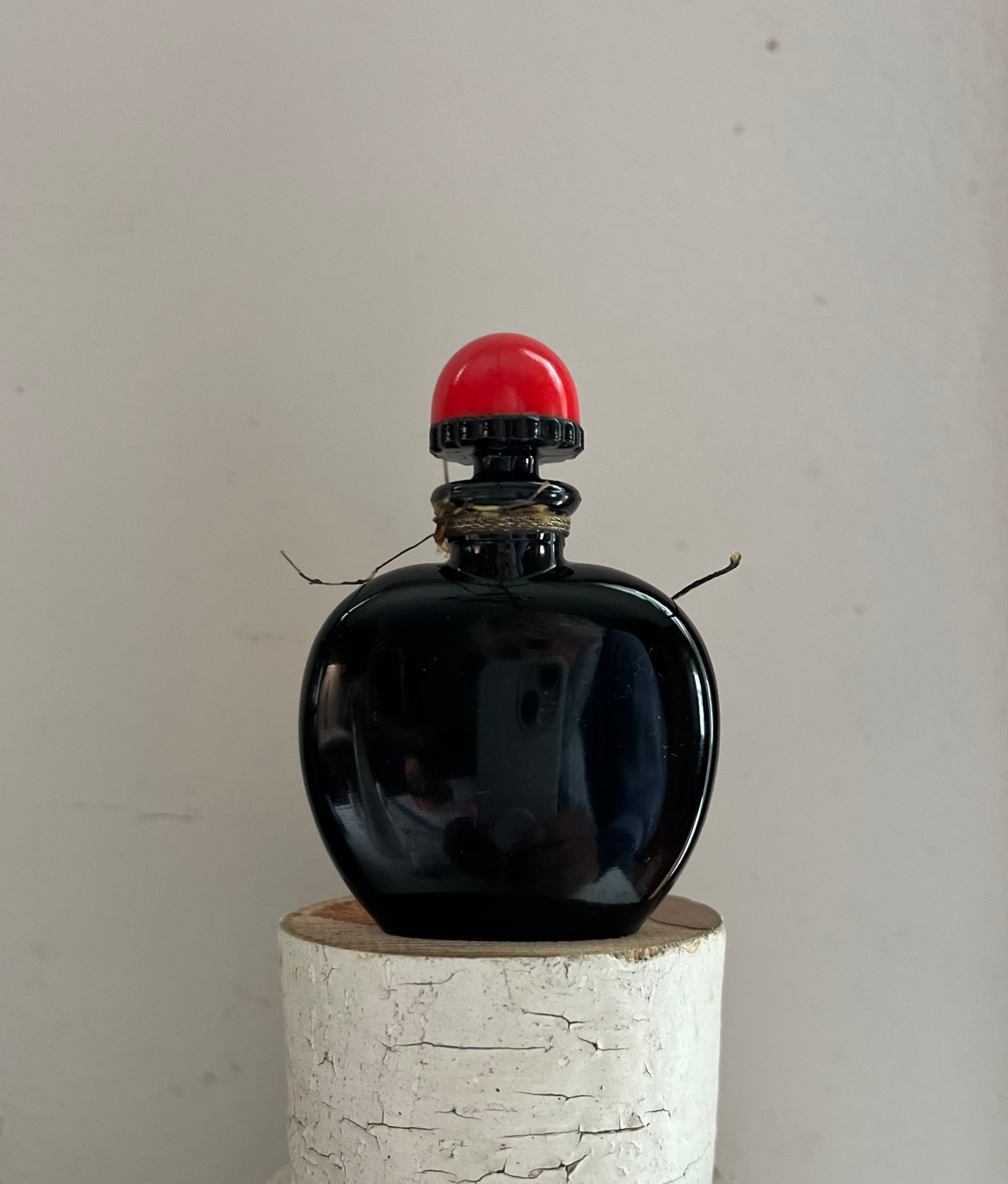 black and red perfume bottle