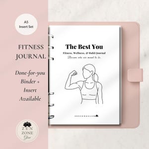 May include: A pink A5 insert set with a fitness journal. The journal cover reads "The Best You" and "Fitness, Wellness, & Habit Journal." A line drawing of a person flexing their arm is on the page. The journal is in a pink binder.