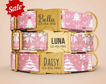 May include: Pink dog collars with gold buckles, featuring white Christmas trees and bows. Each collar is personalized with a name and phone number. The word "Sale" is in a red starburst.