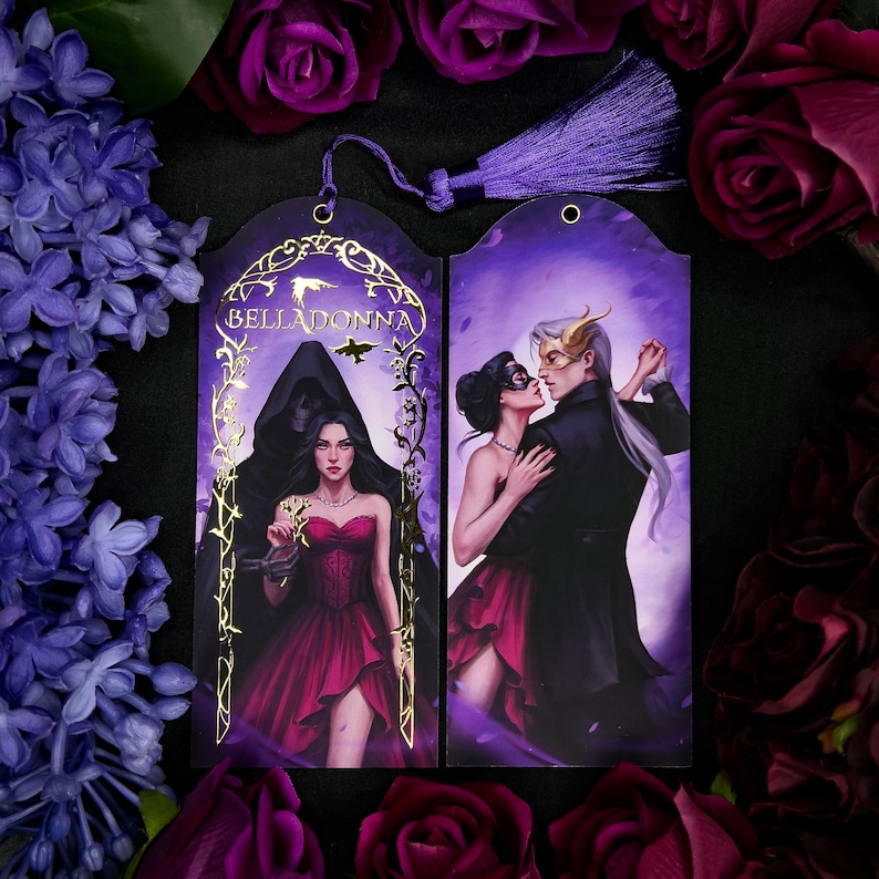 May include: Two purple bookmarks with illustrations and a tassel. One bookmark features a woman in a red dress with the word "BELLADONNA". The other shows a couple dancing. The bookmarks are surrounded by purple flowers.