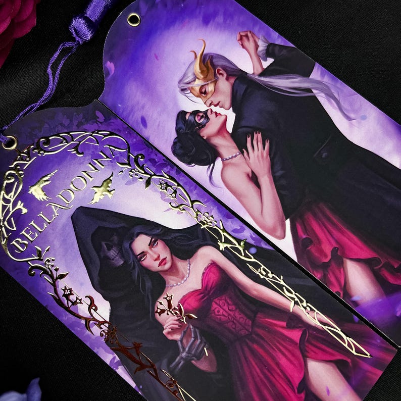 May include: Two decorative bookmarks with illustrations. One features a couple in formal attire, the other a woman in a red dress with a skeleton hand. Gold foil accents and the word "BELLADONNA" are visible.