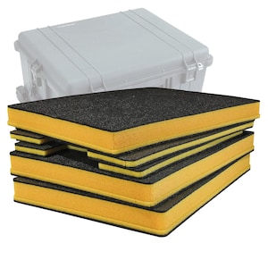 May include: A stack of black and yellow foam inserts for a protective case. The foam has a black top and bottom with yellow sides. A gray protective case is in the background.