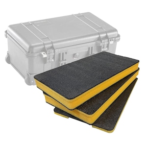 May include: A stack of three black and yellow foam inserts for a protective case. The foam is rectangular and has a yellow core with black outer layers. A gray protective case is in the background.