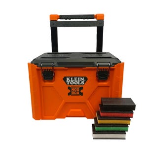 May include: A bright orange Klein Tools Mod Box rolling tool chest with a black lid and retractable handle. The front features the black Klein Tools Mod Box logo. Beside the chest is a stack of six rectangular sanding sponges in various colours.