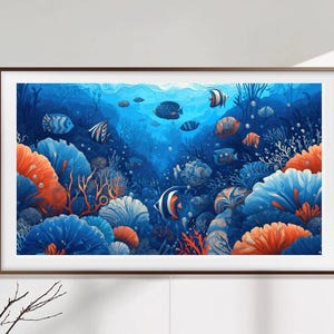 May include: A framed print of a colorful underwater scene with coral reefs and tropical fish. The fish are blue, orange, and white, and the coral is pink, orange, and green. The background is a deep blue.