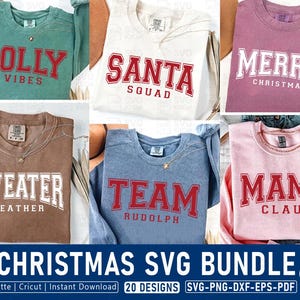 May include: A collection of six crewneck sweatshirts in various colors including green, white, mauve, brown, blue, and pink. Each sweatshirt features collegiate-style text designs with phrases such as JOLLY VIBES, SANTA SQUAD, MERRY CHRISTMAS, SWEATER WEATHER, TEAM RUDOLPH, and MAMA CLAUS.
