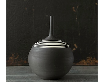 One stoneware vase, rotund shape, raw unglazed black clay with inlaid porcelain striped by Sara Paloma Pottery