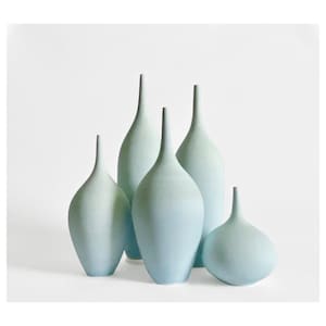 May include: Five ceramic vases in various sizes and shapes, all in a light blue color with a gradient effect. The vases are arranged in a staggered formation on a white background.