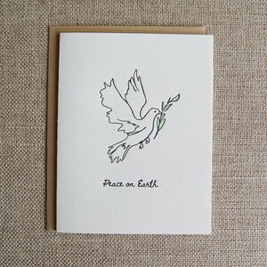 La paix sur la terre, carte typographique de dessin au trait colombe