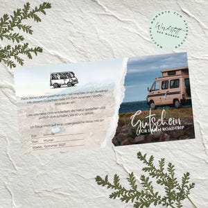 May include: A rectangular gift voucher featuring a sketch of a van, a photograph of a beige camper van by the sea, and German text including 'Gutschein für einen Roadtrip', 'Für: Jorinde', 'Von: Muriel', and 'Wann: Sommer 2027' on a textured background.