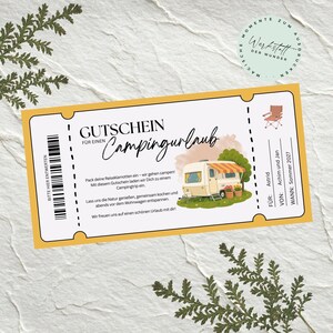 May include: A rectangular gift voucher with a yellow border featuring the text GUTSCHEIN FÜR EINEN Campingurlaub, a graphic of a beige camper trailer, a folding chair icon, and fields for recipient, sender, and date, Summer 2027.