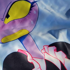 May include: A close-up of a cartoon character with a purple head, yellow eyes, and a black and white outfit. The character has a maid outfit with a pink trim and a white frilly collar. The background is light blue.