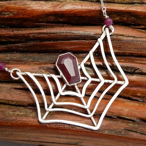 The Little Web of Death Necklace - Ruby Coffin Centered in a Sterling Silver Spiderweb
