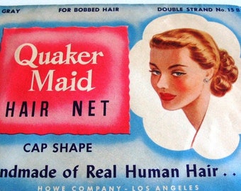 May include: A vintage Quaker Maid hair net package with a red and white label. The label says "Quaker Maid Hair Net" and "Handmade of Real Human Hair..." The package is blue and white and features a drawing of a woman with blonde hair.
