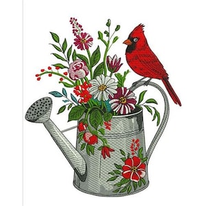 May include: An embroidered design featuring a galvanized metal watering can overflowing with colorful flowers and greenery. A vibrant red cardinal bird perches on the handle. The design includes red, pink, white, and green elements.