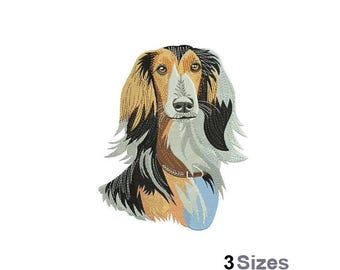 May include: Embroidered design of a brown and black Saluki dog with a blue collar. The dog is looking directly at the viewer.