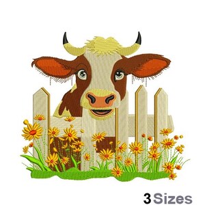 May include: A brown and white cow with a yellow face peeks over a white picket fence. The fence is surrounded by green grass and yellow flowers.