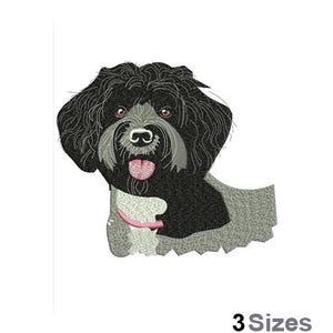 May include: Embroidered design of a black and white Portuguese Water Dog with a pink collar. The dog is looking directly at the viewer with its tongue sticking out.