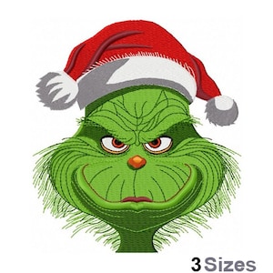 May include: Green Grinch face with a red Santa hat and white trim. The Grinch is smiling with a mischievous look in his eyes.