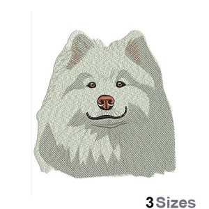 May include: Embroidered design of a white fluffy dog with a brown nose. The dog is looking directly at the viewer.