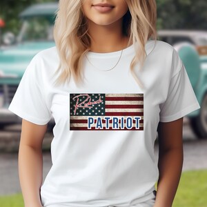 May include: White t-shirt with a distressed American flag design and the text "Redneck Patriot" in red and blue.