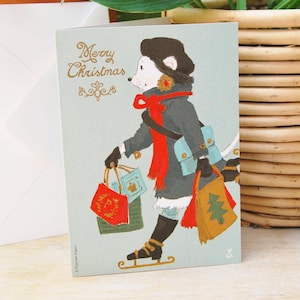 Carte de Noël Souris Ernestine | Shopping de Noël nostalgique sur patins | Cartes de Noël mignonnes et douces dessinées à la main