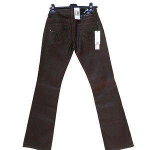 Flared pants Vintage Y2k Calvin Klein jeans trousers brown flared denim pant CK women&#39;s jeans, size 28.