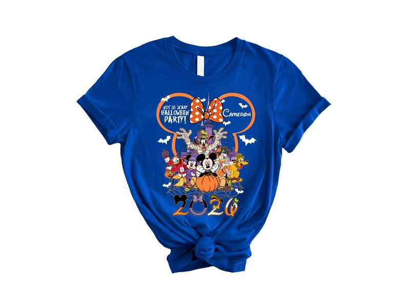 May include: A royal blue short-sleeve t-shirt featuring a graphic of Disney characters in Halloween costumes, a castle, and the text "NOT SO SCARY HALLOWEEN PARTY!", "CAMERON", and "2020" with a large orange Mickey Mouse ear outline and bats.