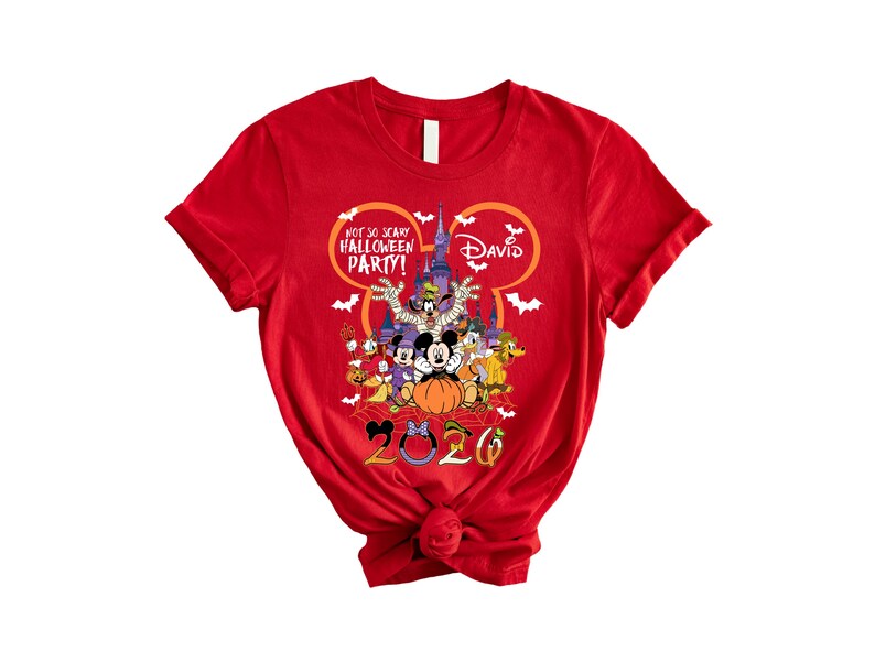 May include: A red short-sleeved t-shirt featuring a graphic of Disney characters in front of a castle. The text reads Not So Scary Halloween Party, David, and 2026. The design includes a Mickey Mouse head outline, bats, and a spider web.