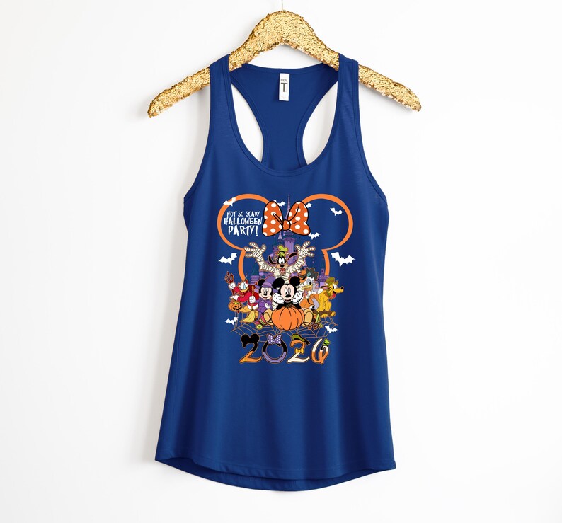 May include: A dark blue racerback tank top featuring a graphic of Disney characters in Halloween costumes. The design includes the text "Not So Scary Halloween Party!" and "2020" with a large orange pumpkin, a polka dot bow, and white bats.