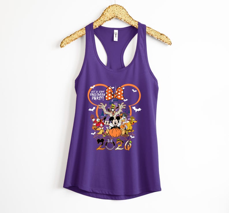 May include: A purple racerback tank top featuring a graphic of Disney characters in Halloween costumes, a pumpkin, and a castle silhouette. The text reads Not So Scary Halloween Party and 2020, framed by an orange Mickey Mouse ear outline.