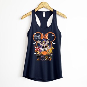 May include: A navy blue racerback tank top featuring a graphic of Disney characters in Halloween costumes. The design includes the text "NOT SO SCARY HALLOWEEN PARTY!" and "2020" with a large orange pumpkin, a castle silhouette, and white bats.