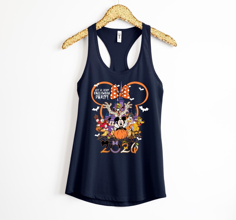 May include: A navy blue racerback tank top featuring a graphic of Disney characters in Halloween costumes. The design includes the text "NOT SO SCARY HALLOWEEN PARTY!" and "2020" with a large orange pumpkin, a castle silhouette, and white bats.