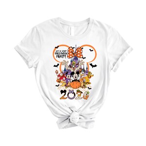 May include: A white t-shirt featuring a graphic of Disney characters in Halloween costumes, a castle, and the text "NOT SO SCARY HALLOWEEN PARTY!" inside a Mickey Mouse ear outline. The year "2020" is printed at the bottom with orange and purple accents.