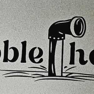 May include: Black and white graphic of a submarine periscope emerging from the water, with the words "Bubble head" in a bold, stylized font. The design is set against a light gray background.