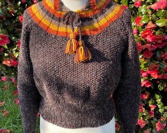 1930s sweater with coloured yoke and tassel fastenings. Thick wool blend yarn in brown with gold, rust and nutmeg.