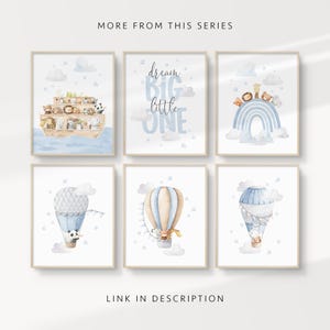 May include: Six framed watercolor prints with a nursery theme. The prints feature animals on an ark, a blue rainbow, hot air balloons, and the text "dream BIG little ONE". The color palette includes blue, beige, and white.