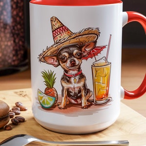 May include: White ceramic mug with a red rim and handle. The mug features a cartoon chihuahua wearing a sombrero and holding a margarita glass. The text "Fiesta" is printed on the mug.