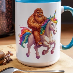 Bigfoot Riding Unicorn Coffee Mug: Fantasy Sasquatch Novelty Gift