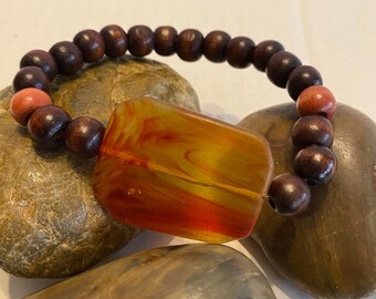 Natural Wood with a focal bead .. Beaded Bracelet