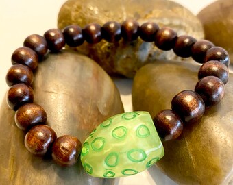Natural Wood with a focal bead .. Beaded Bracelet