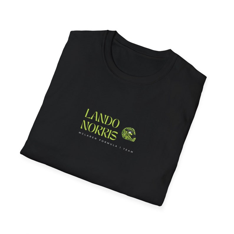 May include: Black t-shirt with a green logo that says "Lando Norris McLaren Formula 1 Team"