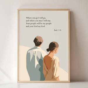 May include: A framed art print with an illustration of a couple, set against a light beige backdrop. The print displays the text "Where you go I will go..." from Ruth 1:16. The frame is a light wood colour.