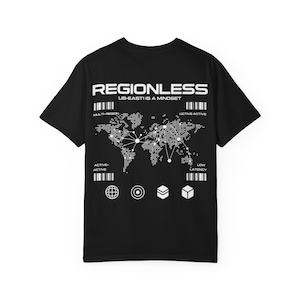 May include: Black t-shirt with a white graphic design. The design includes the word "REGIONLESS", the text "US-EAST IS A MINDSET", a world map, and various geometric shapes and bar codes.